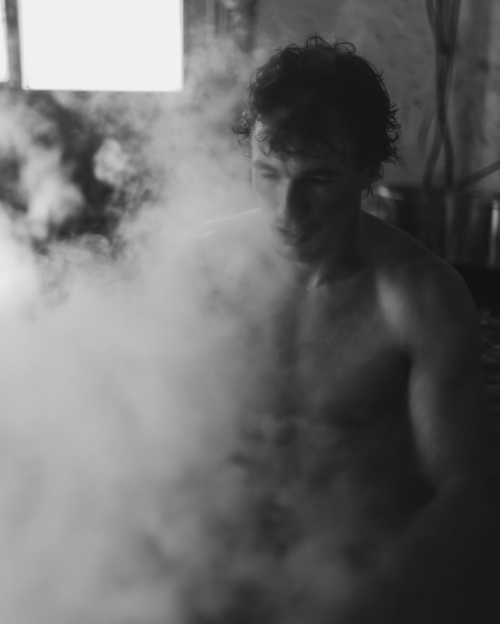 Person recovering after steam sauna — REVIVR clean hydration with sodium and potassium